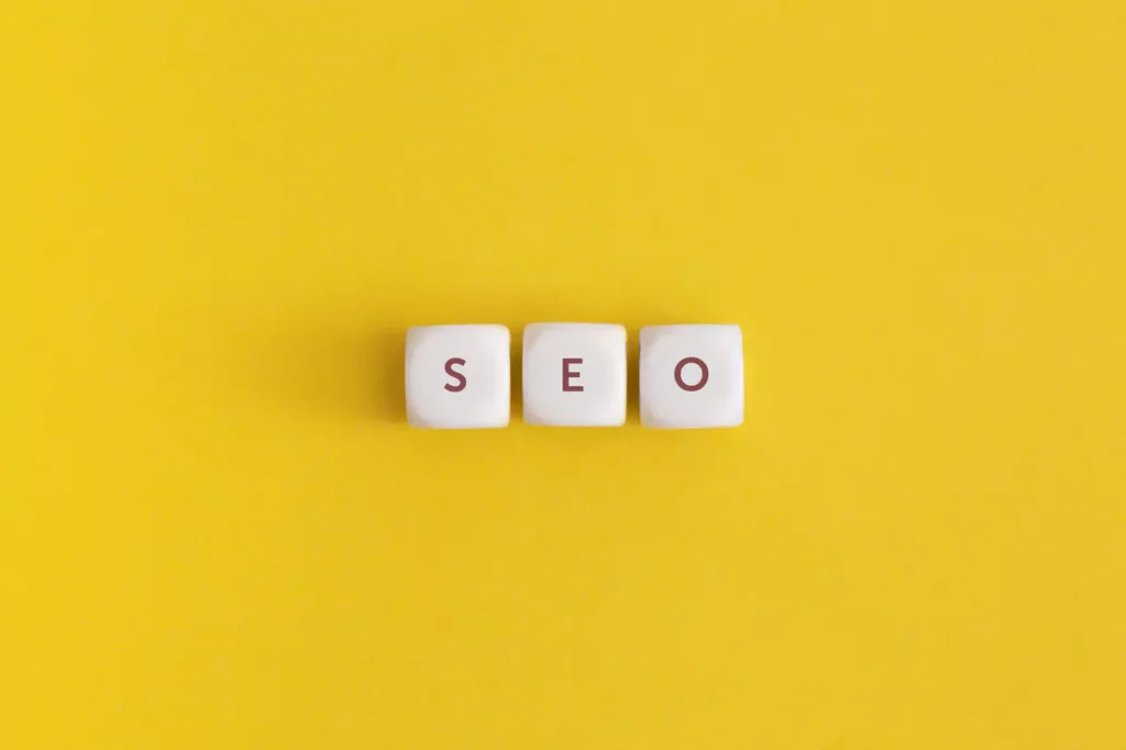 the word seo on yellow background top view